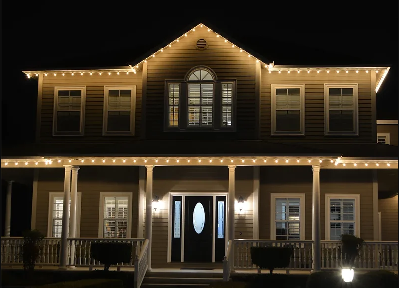 Elegant home illuminated with LED Christmas lights, showcasing professional holiday lighting installation for festive decor.