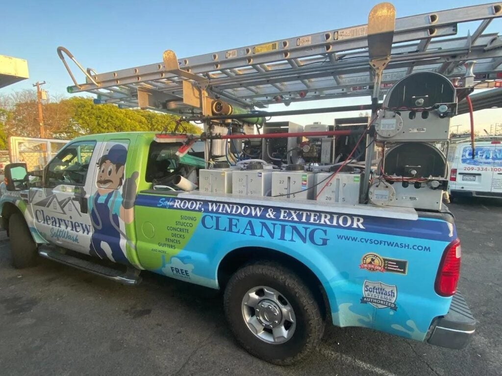 Clearview SoftWash truck equipped for safe roof, window, and exterior cleaning with soft washing technology, featuring eco-friendly solutions and a ladder on top.